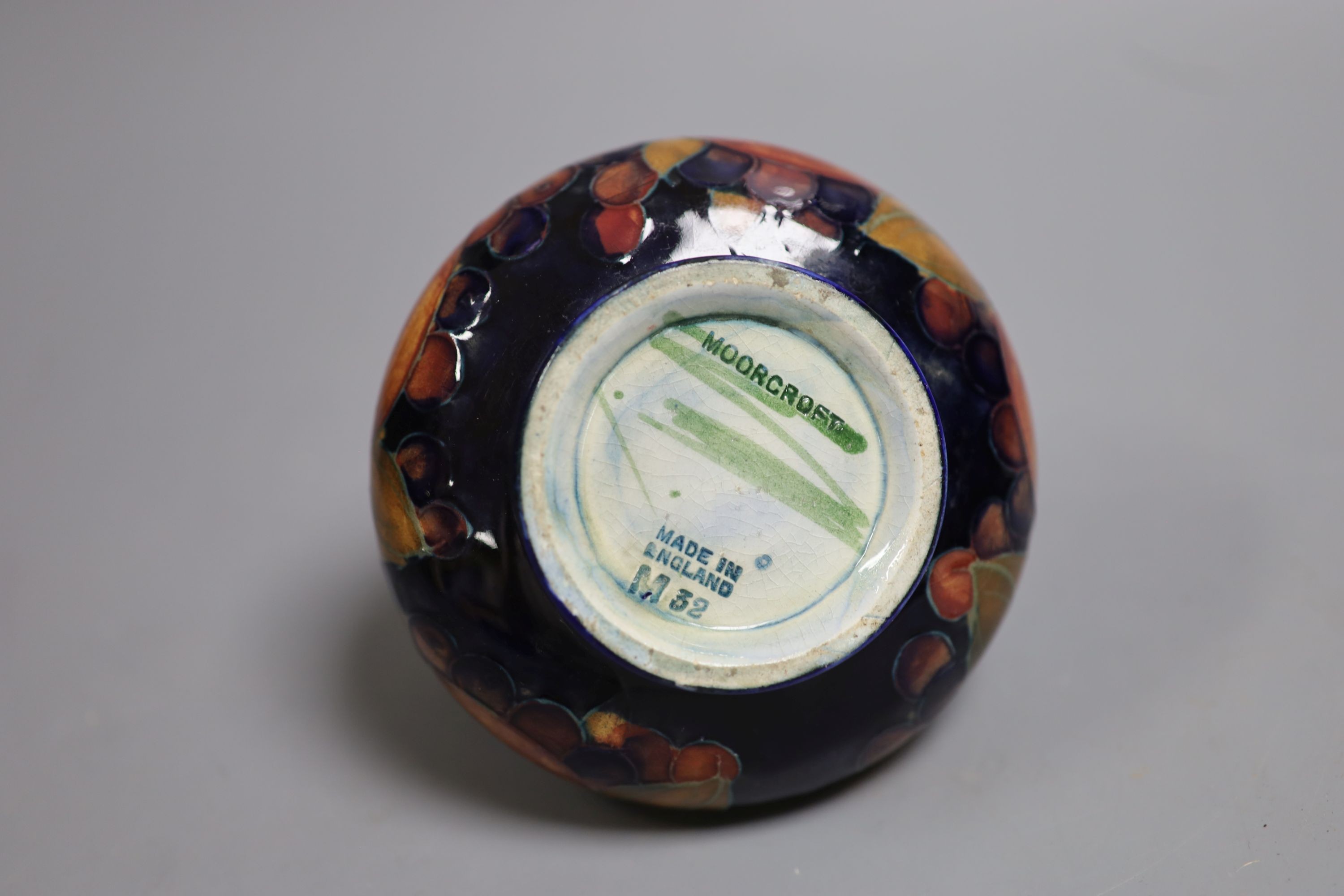 A Moorcroft Pomegranate squat baluster vase, 9cm high